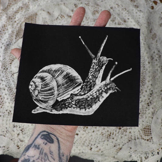 parche de caracol de dos cabezas