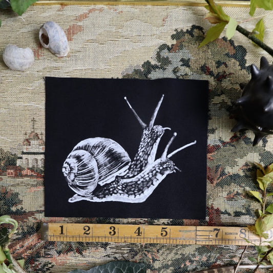 parche de caracol de dos cabezas